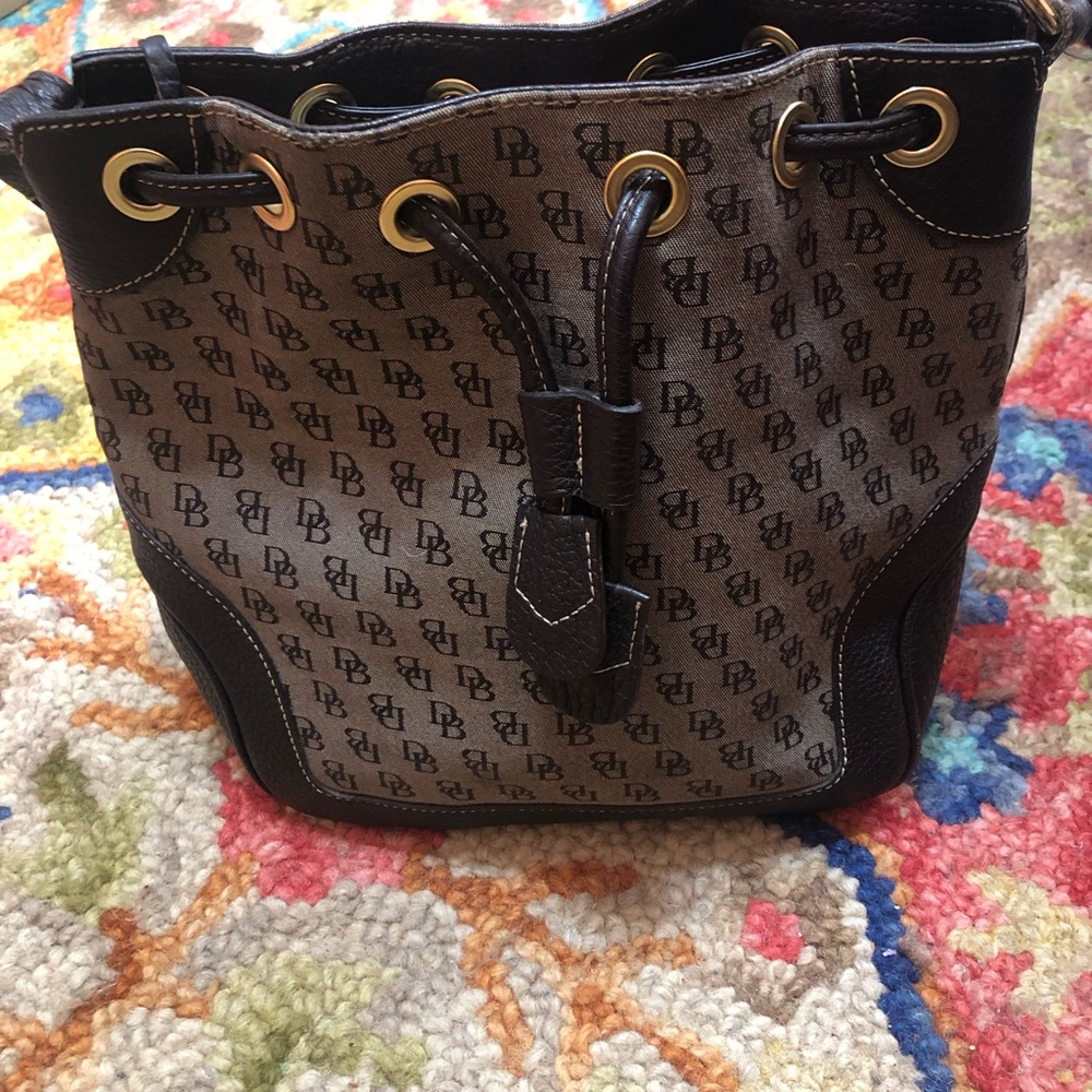 Dooney & Bourke Expresso Brown Bucket Bag with Draw String. Shows signs of wear.